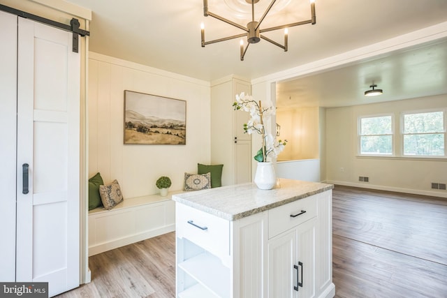 27136 Dogwood Ln, Mechanicsville, MD 20659 - detailed view of wood finished floors, a chandelier, and a barn door
