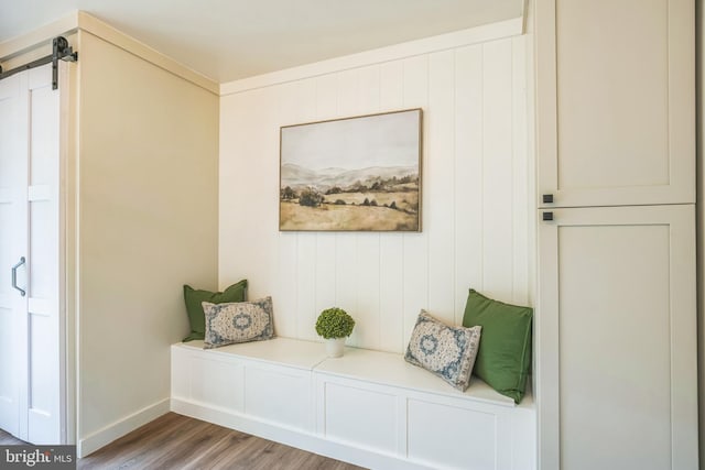 27136 Dogwood Ln, Mechanicsville, MD 20659 - mudroom featuring wood finished floors, baseboards, and a barn door