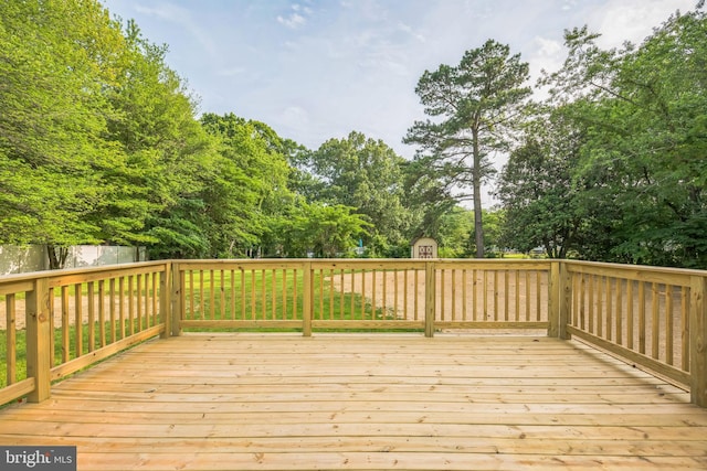 27136 Dogwood Ln, Mechanicsville, MD 20659 - deck featuring a shed and view of wooded area