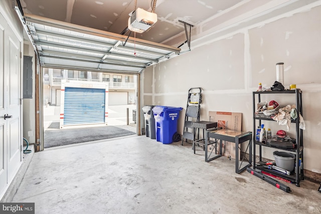 43436 Apple Orchard Sq, Ashburn, VA 20148 - garage featuring a garage door opener and electric panel