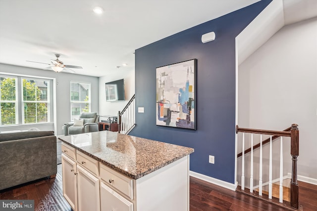 43436 Apple Orchard Sq, Ashburn, VA 20148 - kitchen featuring dark wood-style floors, light stone counters, open floor plan, white cabinetry, and recessed lighting
