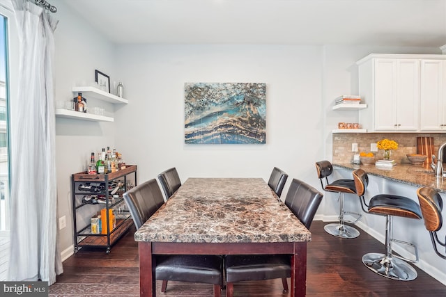 43436 Apple Orchard Sq, Ashburn, VA 20148 - dining room with dark wood-type flooring and baseboards