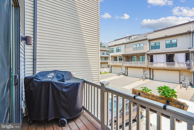 43436 Apple Orchard Sq, Ashburn, VA 20148 - wooden deck with a grill, a residential view, and a garage