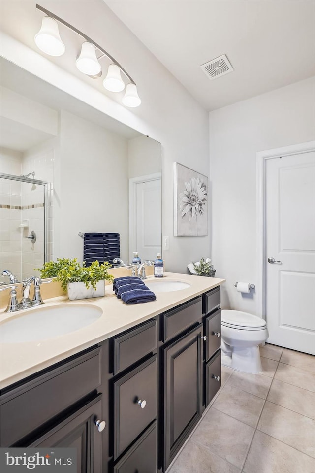 43436 Apple Orchard Sq, Ashburn, VA 20148 - bathroom featuring double vanity, a shower stall, and tile patterned flooring