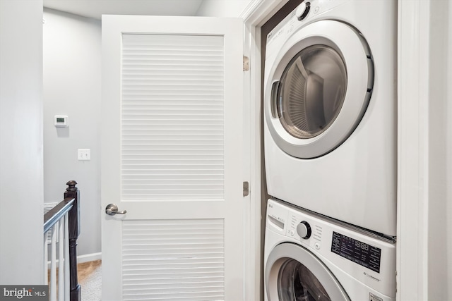 43436 Apple Orchard Sq, Ashburn, VA 20148 - laundry room with estacked washer and dryer and carpet