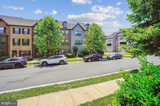43436 Apple Orchard Sq, Ashburn, VA 20148 - view of asphalt street featuring curbs, a residential view, and sidewalks