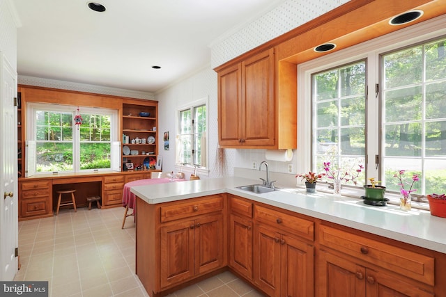 330 Cherry Hill Rd, Princeton, NJ 08540 - kitchen featuring wallpapered walls, a sink, light countertops, a peninsula, and brown cabinets