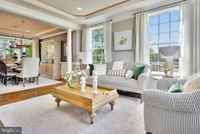 4420 Breidenbaugh Ln, Glen Arm, MD 21057 - living room with plenty of natural light, wood finished floors, crown molding, and ornate columns