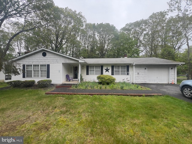 8 Cedar Rd, Mount Pocono, PA 18344 - ranch-style home featuring an attached garage, asphalt driveway, and a front lawn