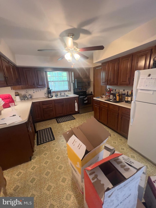 8 Cedar Rd, Mount Pocono, PA 18344 - kitchen featuring appliances with stainless steel finishes, a sink, a ceiling fan, and light countertops