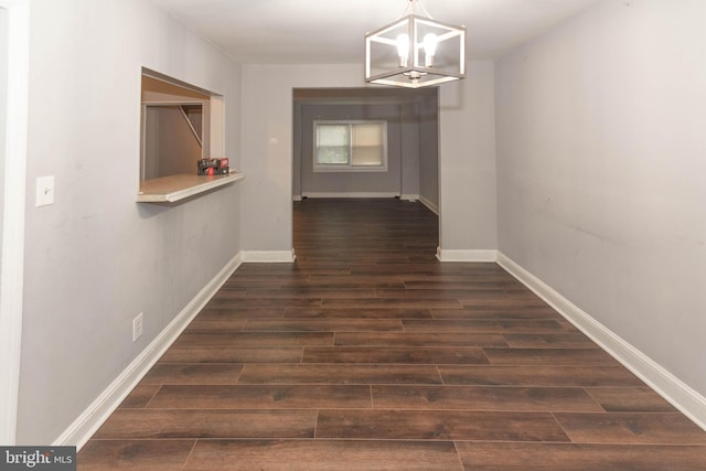 5603 Clearspring Rd, Baltimore, MD 21212 - hallway with dark wood finished floors, a chandelier, and baseboards