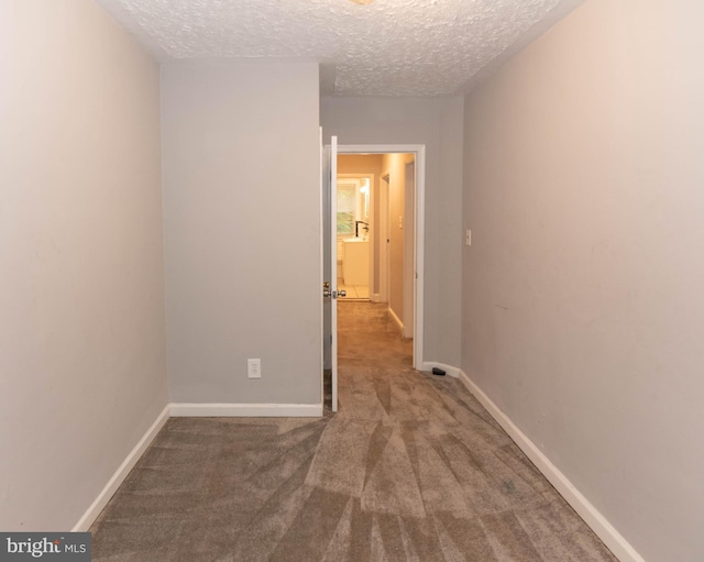 5603 Clearspring Rd, Baltimore, MD 21212 - unfurnished room featuring carpet, a textured ceiling, and baseboards