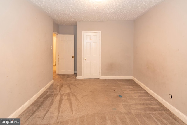 5603 Clearspring Rd, Baltimore, MD 21212 - empty room with carpet floors, a textured ceiling, and baseboards