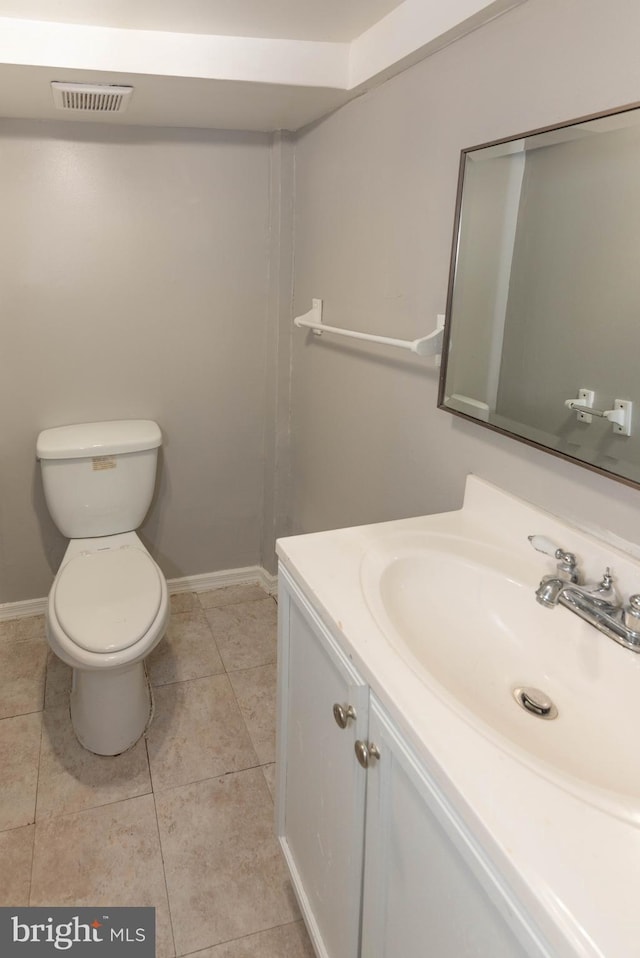 5603 Clearspring Rd, Baltimore, MD 21212 - bathroom with vanity, toilet, baseboards, and tile patterned floors
