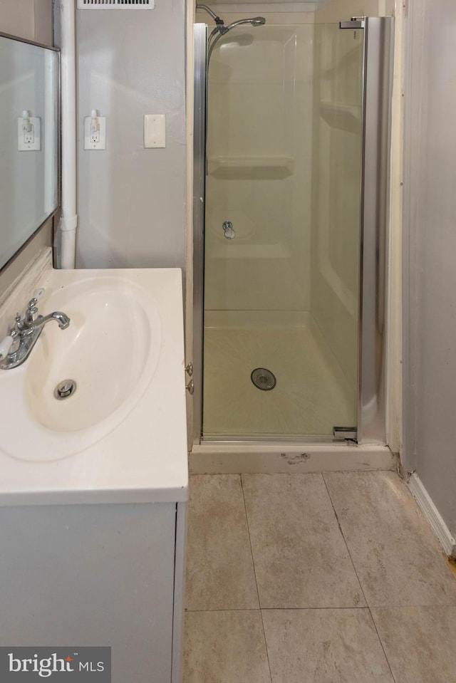 5603 Clearspring Rd, Baltimore, MD 21212 - full bath with a stall shower, vanity, and tile patterned flooring