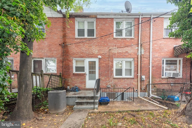 5603 Clearspring Rd, Baltimore, MD 21212 - rear view of property with brick siding, a patio, cooling unit, and central air condition unit