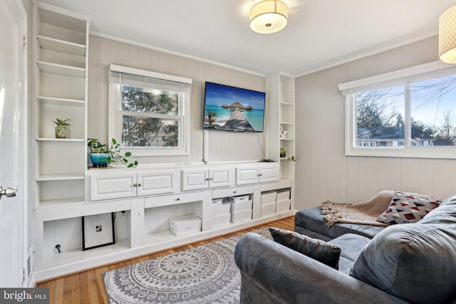 6937 Halleck St, District Heights, MD 20747 - living area with ornamental molding, wood finished floors, and wood walls