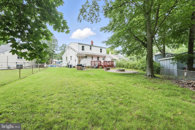 6937 Halleck St, District Heights, MD 20747 - fenced backyard with a fire pit and a deck