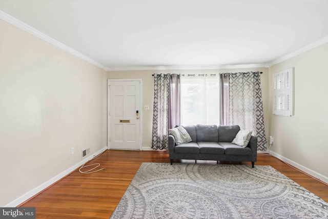 6937 Halleck St, District Heights, MD 20747 - living area featuring healthy amount of natural light, ornamental molding, and wood finished floors