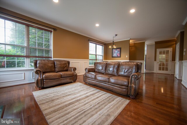 112 Jeffords Ct Unit 1601, Phoenixville, PA 19460 - living area featuring crown molding, a decorative wall, a wainscoted wall, and dark wood-style floors