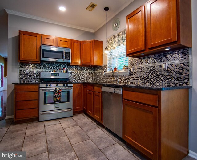 112 Jeffords Ct Unit 1601, Phoenixville, PA 19460 - kitchen featuring stainless steel appliances, ornamental molding, dark countertops, and brown cabinets