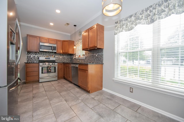 112 Jeffords Ct Unit 1601, Phoenixville, PA 19460 - kitchen featuring stainless steel appliances, ornamental molding, decorative backsplash, dark countertops, and brown cabinets