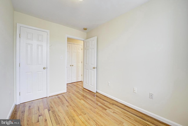 1030 Fairmont St NW Unit 204, Washington, DC 20001 - unfurnished bedroom featuring baseboards and light wood finished floors