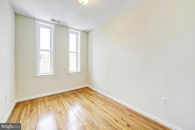 1030 Fairmont St NW Unit 204, Washington, DC 20001 - empty room with wood finished floors and baseboards