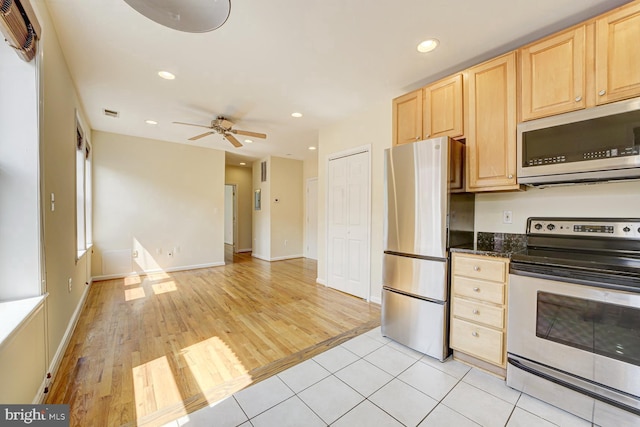 1030 Fairmont St NW Unit 204, Washington, DC 20001 - kitchen with stainless steel appliances, light brown cabinets, a ceiling fan, recessed lighting, and light wood finished floors