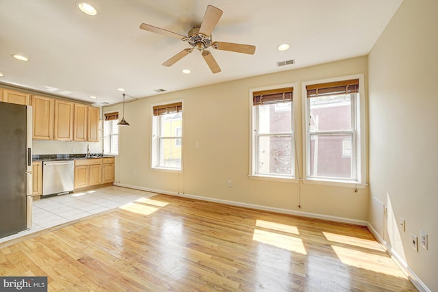 1030 Fairmont St NW Unit 204, Washington, DC 20001 - kitchen featuring appliances with stainless steel finishes, dark countertops, light wood-style floors, ceiling fan, and recessed lighting