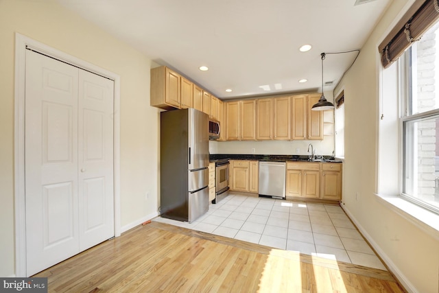 1030 Fairmont St NW Unit 204, Washington, DC 20001 - kitchen featuring stainless steel appliances, dark countertops, light brown cabinetry, a sink, and recessed lighting