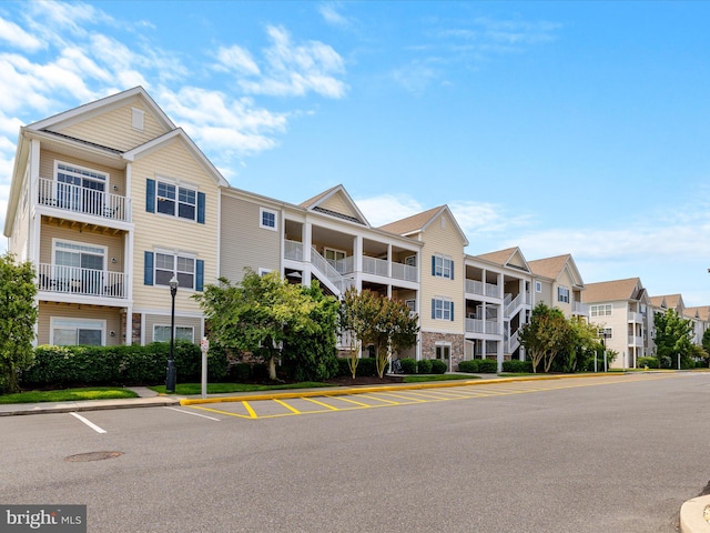20005 Newry Dr Unit Y13, Rehoboth Beach, DE 19971 - view of building exterior featuring uncovered parking