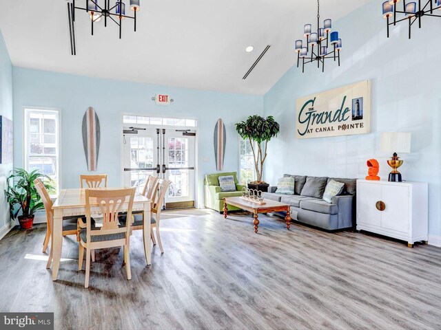 20005 Newry Dr Unit Y13, Rehoboth Beach, DE 19971 - dining room with a chandelier, wood finished floors, french doors, and high vaulted ceiling