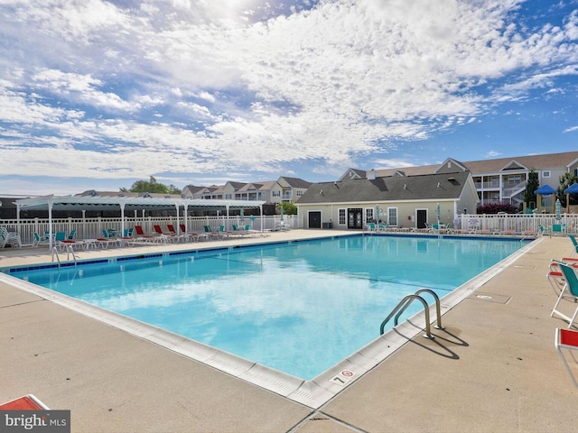 20005 Newry Dr Unit Y13, Rehoboth Beach, DE 19971 - community pool featuring a patio area and a residential view