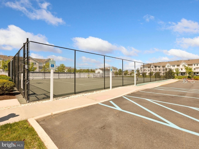 20005 Newry Dr Unit Y13, Rehoboth Beach, DE 19971 - view of tennis court featuring a residential view