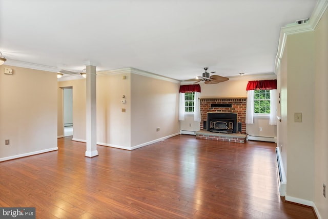 1404 Stockton Rd, Joppa, MD 21085 - unfurnished living room featuring ceiling fan, ornate columns, dark wood-type flooring, ornamental molding, and baseboard heating