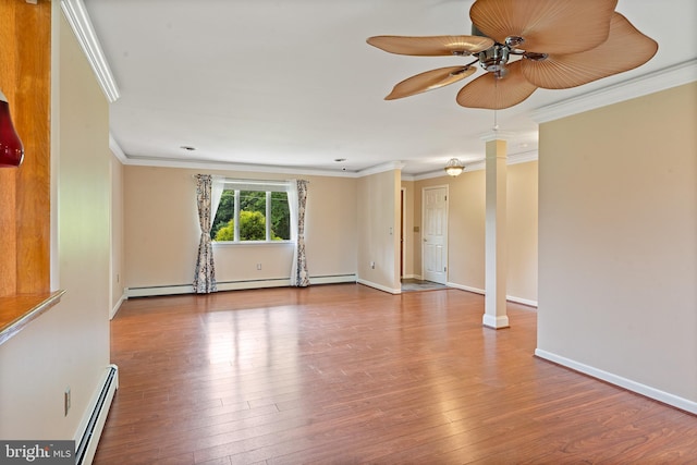 1404 Stockton Rd, Joppa, MD 21085 - empty room featuring a baseboard heating unit, decorative columns, a ceiling fan, and crown molding