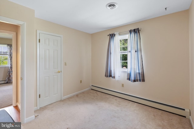 1404 Stockton Rd, Joppa, MD 21085 - unfurnished room with a baseboard radiator, healthy amount of natural light, and carpet
