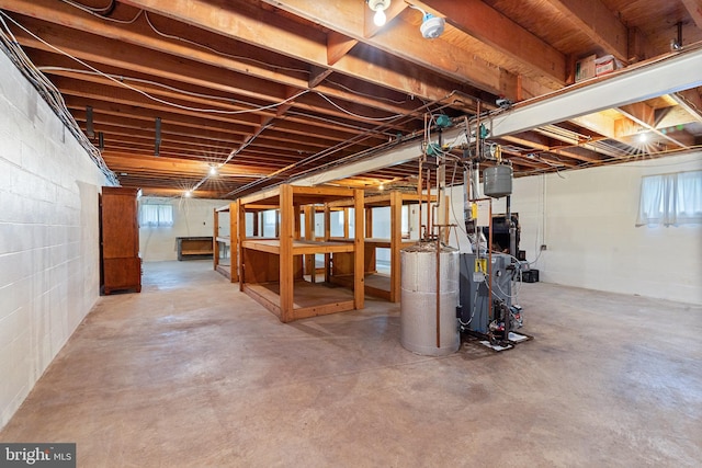 1404 Stockton Rd, Joppa, MD 21085 - below grade area with gas water heater, a heating unit, and concrete block wall