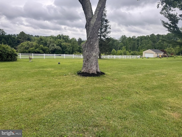 1404 Stockton Rd, Joppa, MD 21085 - view of yard featuring a wooded view, a view of countryside, and a detached garage