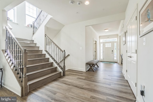 8604 Cedar Chase Dr, Clinton, MD 20735 - entrance foyer featuring wood finished floors, stairway, and baseboards
