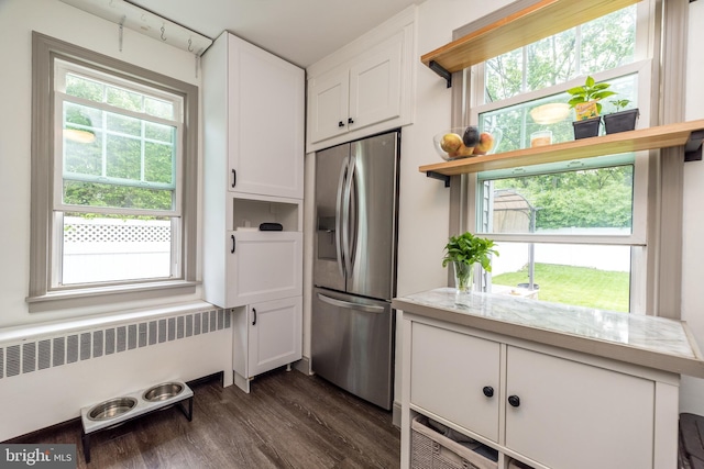832 N Warren St, Pottstown, PA 19464 - kitchen with stainless steel fridge, radiator heating unit, open shelves, white cabinetry, and light countertops