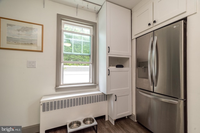 832 N Warren St, Pottstown, PA 19464 - kitchen with stainless steel fridge with ice dispenser, radiator heating unit, white cabinets, and dark wood-style flooring