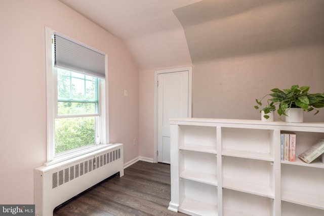 832 N Warren St, Pottstown, PA 19464 - hallway featuring radiator heating unit, lofted ceiling, dark wood-type flooring, and baseboards