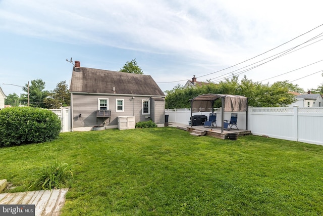 832 N Warren St, Pottstown, PA 19464 - back of property featuring a deck, a chimney, and a gazebo