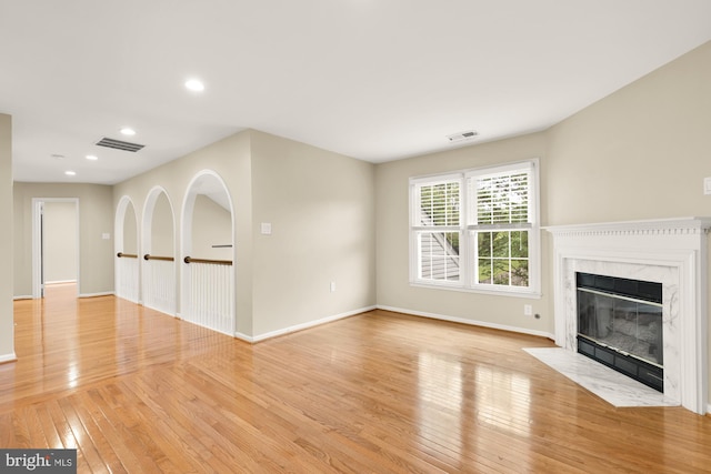 5501 Chestermill Ct, Fairfax, VA 22030 - unfurnished living room featuring light wood-type flooring, a fireplace, and recessed lighting