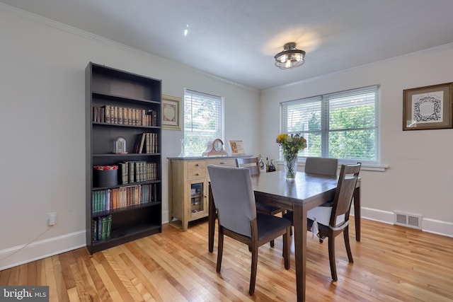 1304 Maple Ave, Lancaster, PA 17603 - dining space featuring crown molding, light wood finished floors, and baseboards