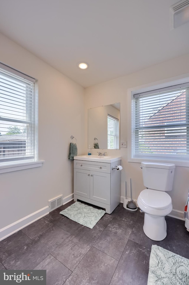1304 Maple Ave, Lancaster, PA 17603 - bathroom featuring vanity, baseboards, toilet, and tile patterned flooring