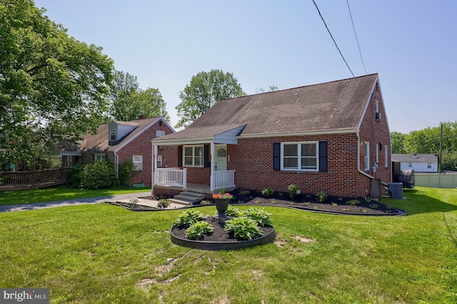 1304 Maple Ave, Lancaster, PA 17603 - view of front of home with central air condition unit, a porch, brick siding, and a shingled roof