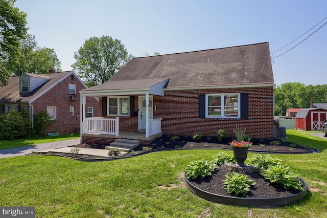 1304 Maple Ave, Lancaster, PA 17603 - view of front of property featuring covered porch, brick siding, and a front lawn